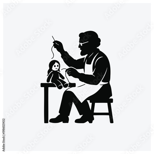 Silhouette of a craftsman working on a doll at a table
