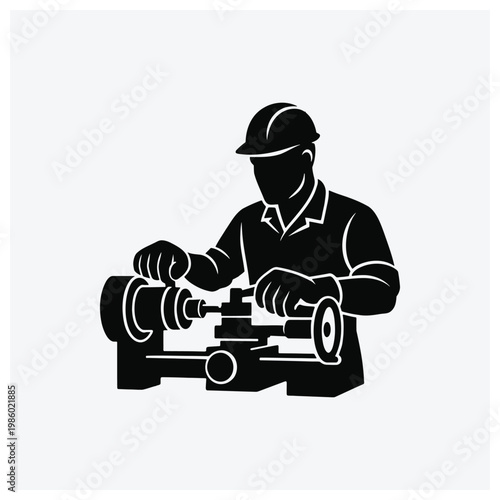 Silhouette of an engineer operating a lathe machine for metalworking or machining