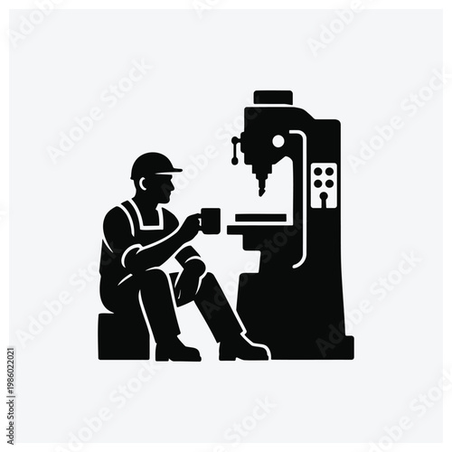 Silhouette of a machinist working at a metal lathe machine.