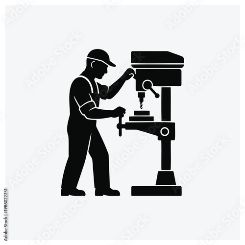 Man operating a machine tool or lathe