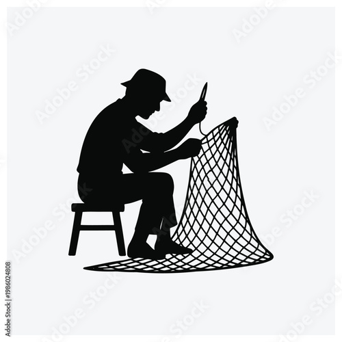 Silhouette of a worker sitting and repairing or creating a net.