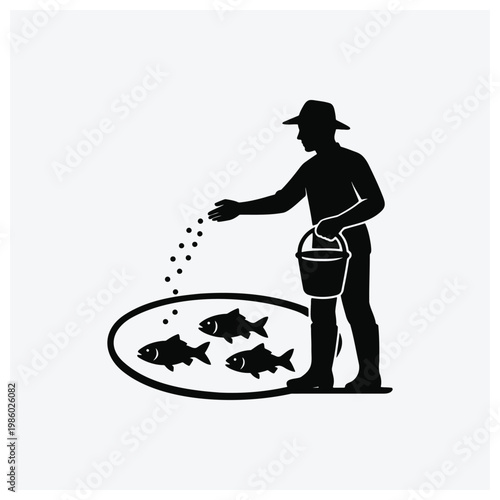 Silhouette of a fisherman feeding fish to a school of fish.