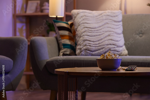 Tasty popcorn with TV remot...