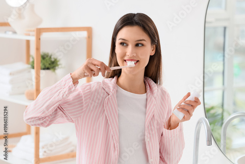 Young woman with paste brus...