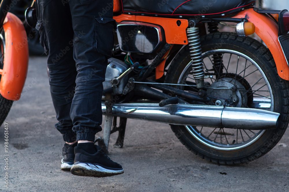 Fototapeta premium old orange retro motorcycle with a two-cylinder internal combustion engine