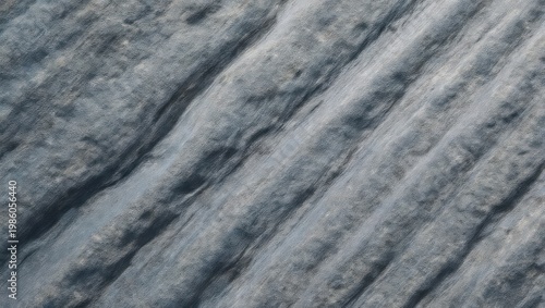 Abstract rock texture with diagonal lines and subtle color variations.