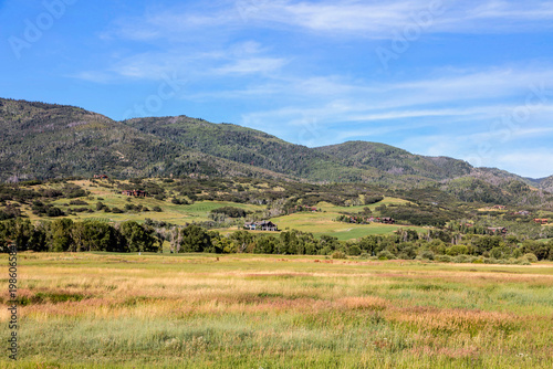 Summer Meadow and Luxury Ranch Homes in Rocky Mountain Foothills