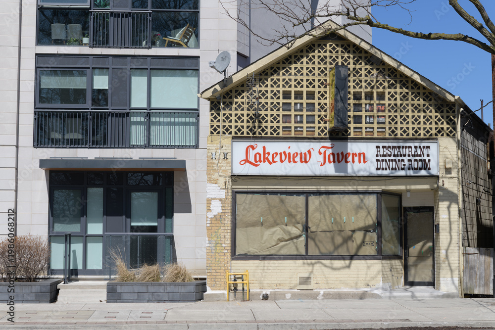 Obraz premium condominium and historic facade and ghost sign of Lakeview Tavern Restaurant Dining Room, located at 1400 Kingston Rd, Toronto