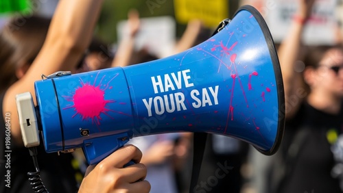Protest Scene with a Blue Megaphone Displaying Have Your Say Message During a Public Demonstration for Free Speech and Civic Engagement in an Urban Setting