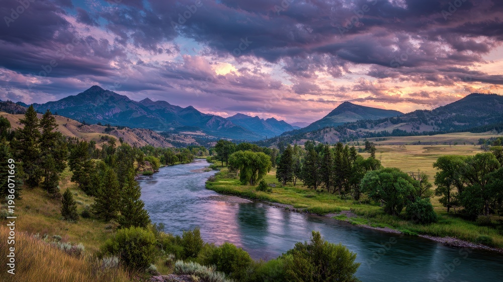 Fototapeta premium Dramatic Sunset over a Winding River in a Mountain Valley