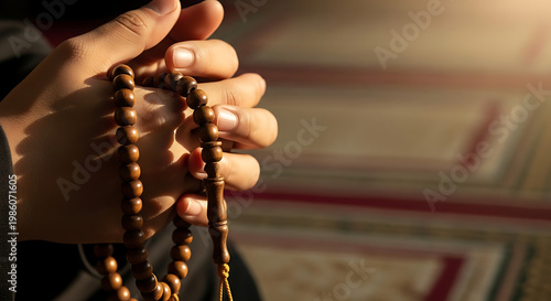 Man's hands counting wooden prayer beads for remembrance of Allah.