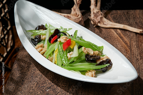 Obraz na plátně Stir-fried bell peppers, celery, wood ear mushrooms, and peach kernels