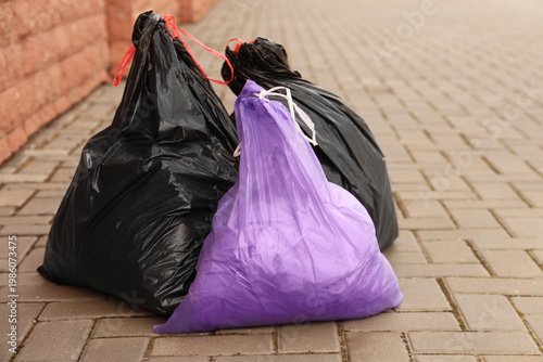 Garbage bags on street in city