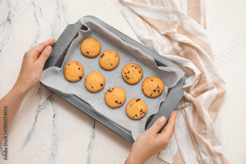 Female hands holding baking...