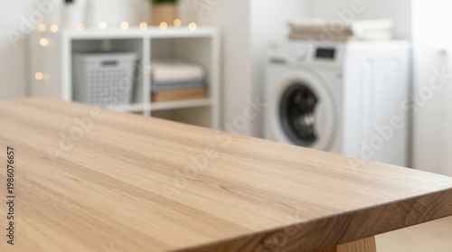 Empty wooden table with laundry room in the background during daytime hours