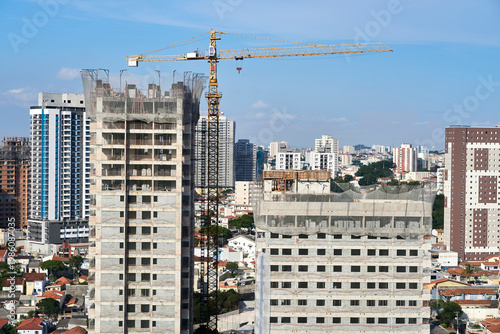 Wallpaper Mural Tower crane over high-rise buildings under construction, urban site Torontodigital.ca
