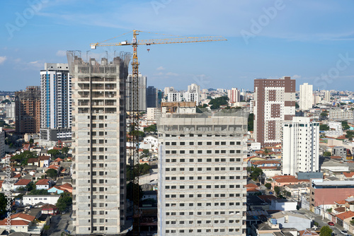 Wallpaper Mural Tower crane over high-rise buildings under construction, urban site Torontodigital.ca