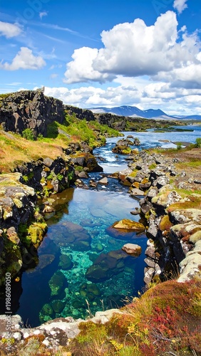 A serene landscape with a crystal-clear river flowing through rugged terrain