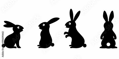 Four black silhouettes of rabbits in varying upright poses