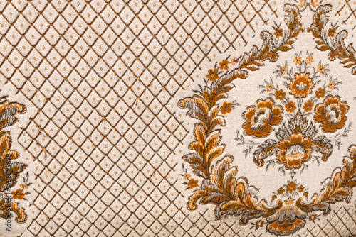 Vintage floral pattern fabric with damask ornament and diamond grid.
