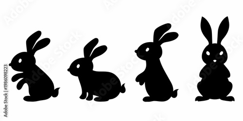 Four black silhouettes of rabbits in various upright positions