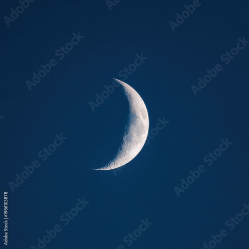 Crescent Moon in Deep Blue Night Sky