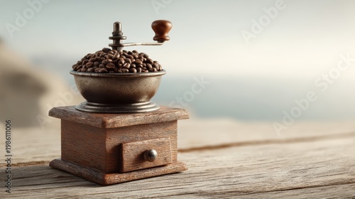 antique coffee mill filled with beans at dawn on wooden table