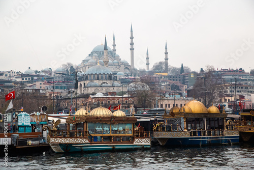 Photography Mosque skyline and traditional boats on the waterfront in Istanbul