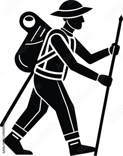 Silhouette of a hiker with backpack and trekking poles walking on a path