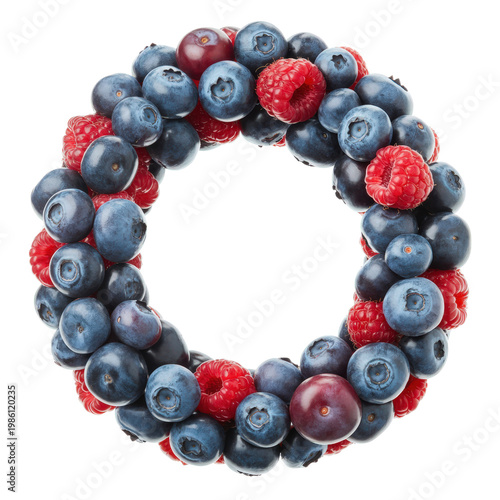 Circular wreath made of fresh blueberries and raspberries isolated on transparent background.