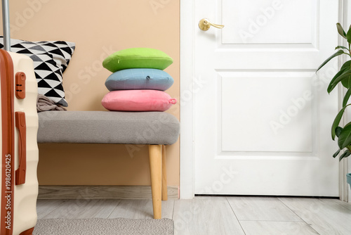 Neck pillows on bench near ...