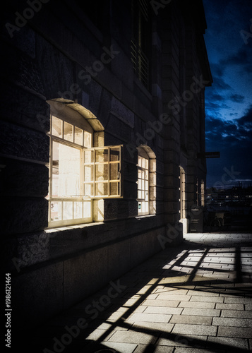 Illuminated Open Window In A Bar At The Royal William Docks, Plymouth At Dusk