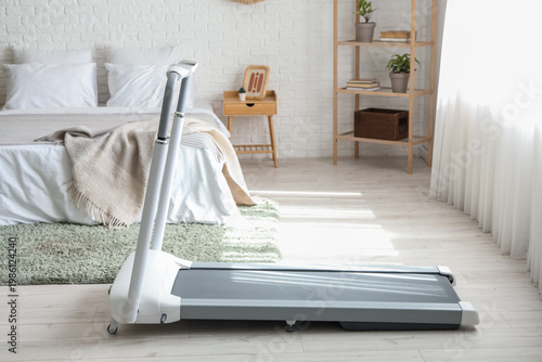 Modern treadmill in interio...