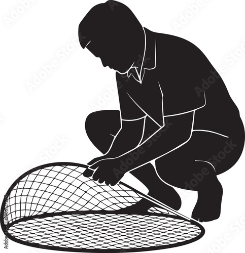 Person repairing or inspecting a large fishing net on a flat surface