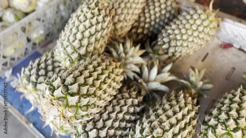 Fresh Ripe Pineapples in Traditional Market Basket