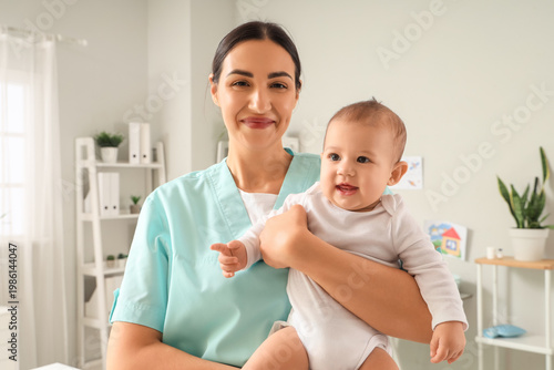 Female pediatrician with cu...