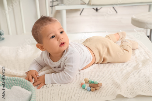 Little baby lying on table ...