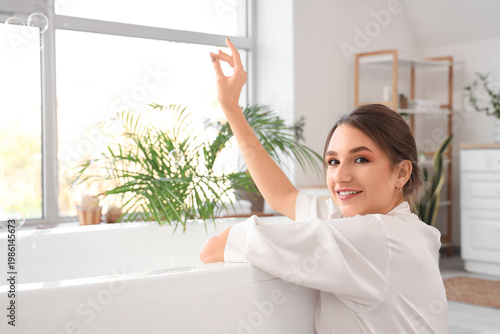 Beautiful woman with soap b...