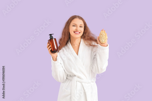 Young woman in bathrobe wit...