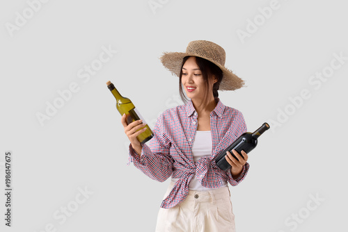 Young Asian woman with bott...