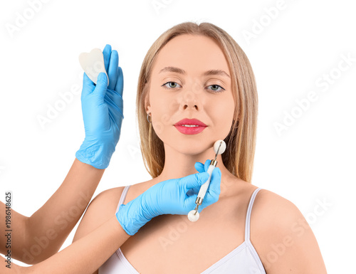 Young woman receiving facia...