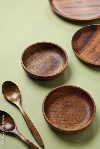 Wooden plates and spoons on...