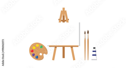 A sturdy wooden tripod easel supports a pristine blank canvas positioned between a colorful paint palette and several long-handled professional brushes.