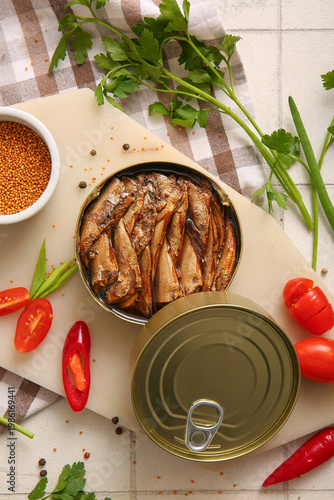 Cuadro en lienzo Board of canned smoked sprats with parsley and chilli on white tile background