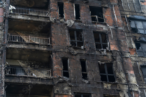 The building was badly damaged by the fire, the ruins and the black wall from the smoke of the fire