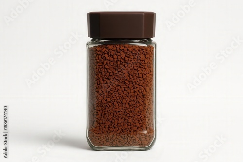 Jar of instant coffee granules on white background 