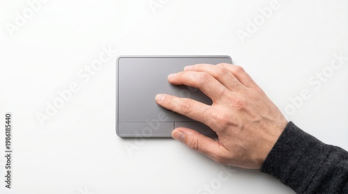 Obraz na płótnie Hand using gray trackpad on white desk