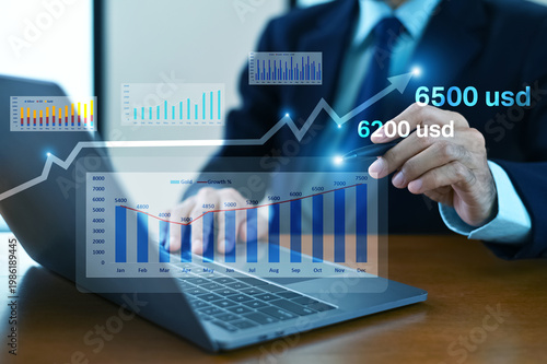 Billede på lærred Financial analyst reviewing gold market data forecasting price surge toward 6000