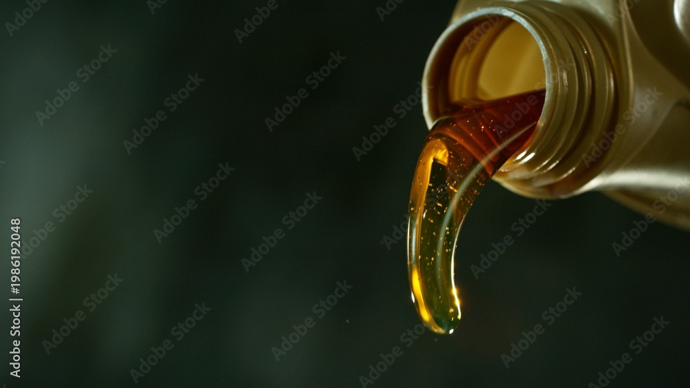 Fototapeta premium Pouring Fresh New Motor Oil