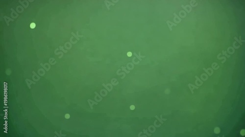 Green background with soft glowing light and floating particles creating calm abstract atmosphere featuring gentle bokeh circles, subtle blur texture, and soothing soft glow effects